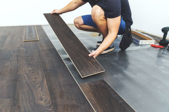 floor being installed with laminate flooring