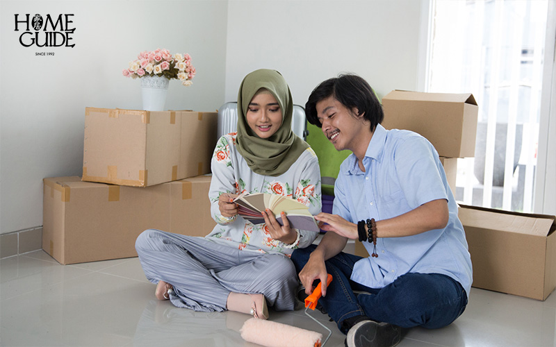 Couple choosing paint colour