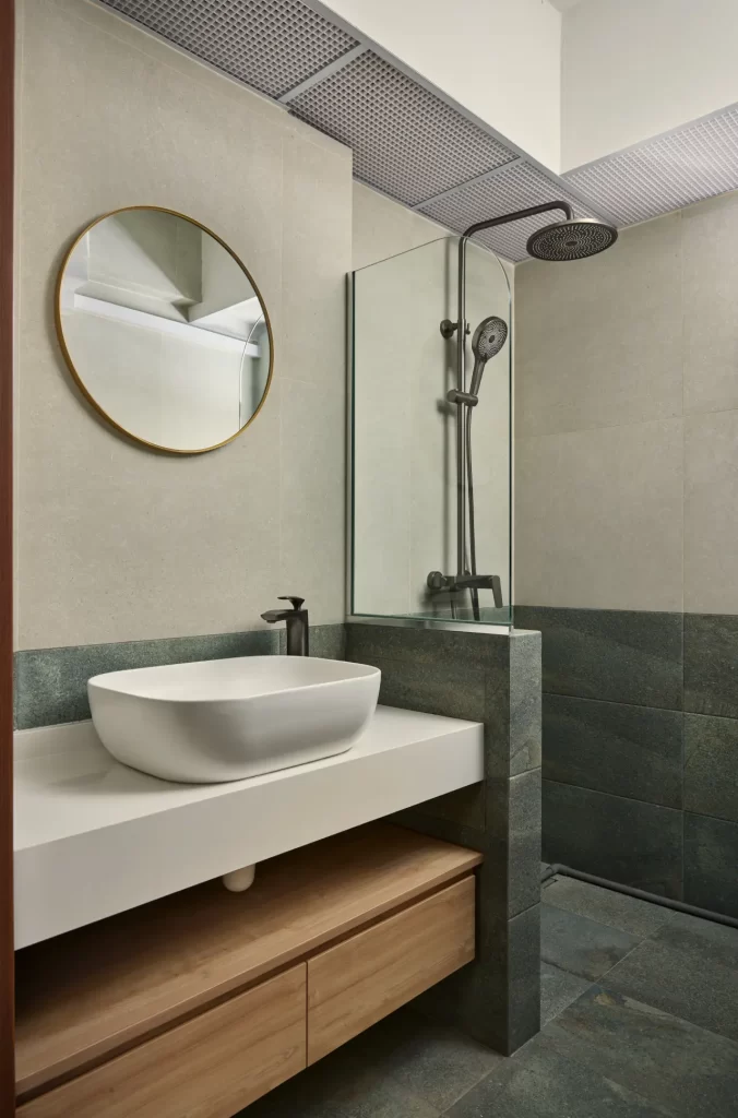 Modern BTO bathroom with vanity, mirror, and glass shower screen