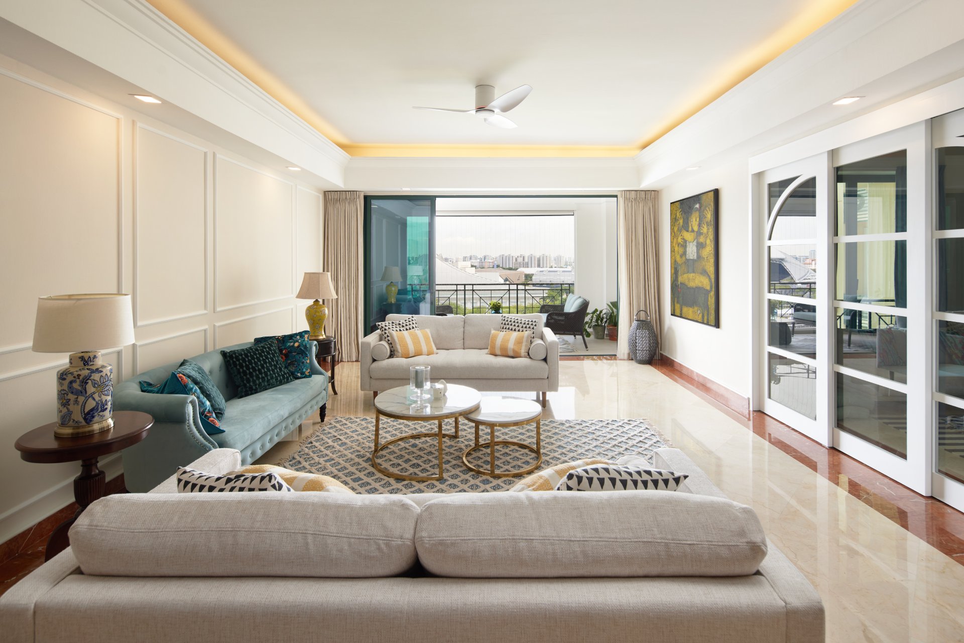 Modern contemporary living room with light sofas and balcony view