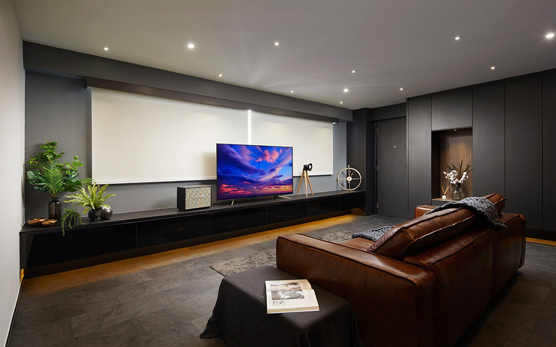 Sleek dark-themed living room interior design in Bukit Gombak.