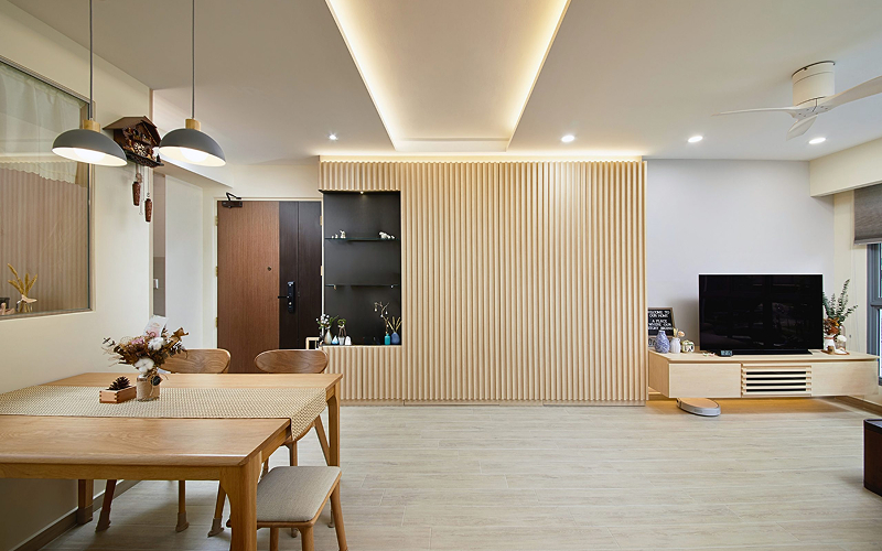Open-concept 4-room BTO layout with fluted wood feature wall.
