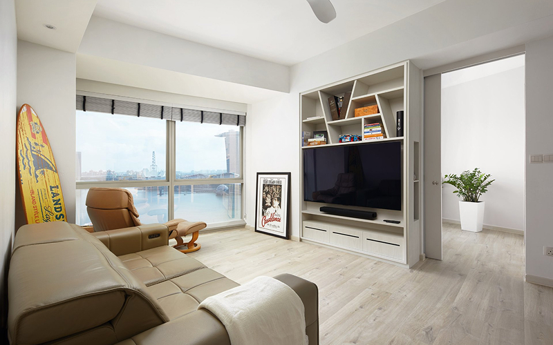 Small condo living room with clever built-in TV storage.