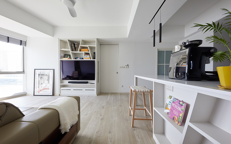 Modern luxury condo living room with custom built-in shelving.